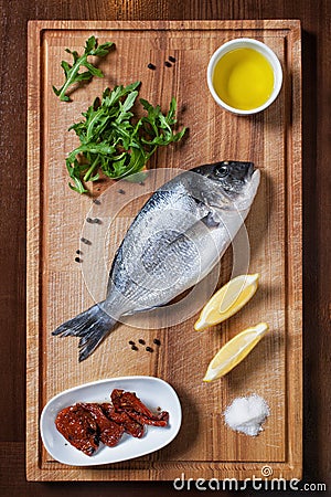 Fresh uncooked dorado fish with ingredients Stock Photo