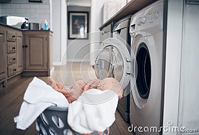 Fresh and unfolded. a laundry basket filled with freshly dried clothes. Stock Photo