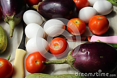 Fresh various raw organic vegetables with white eggs display for healthy and diet background. Stock Photo