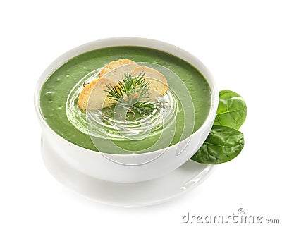 Fresh vegetable detox soup made of spinach with croutons in dish and leaves Stock Photo
