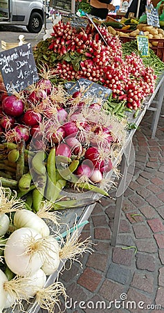 Fresh summer seasonal vegetable produce on market stall Editorial Stock Photo