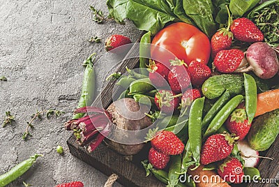 Fresh vegetables, berries, greens and fruits in tray Stock Photo