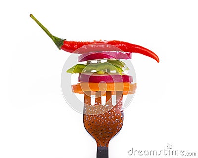 Fresh vegetables on a fork isolated on white background Stock Photo