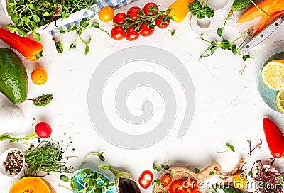 Fresh vegetables, fruits, microgreens and herbs for cooking healthy meals at home. Food frame with copy space, top view Stock Photo