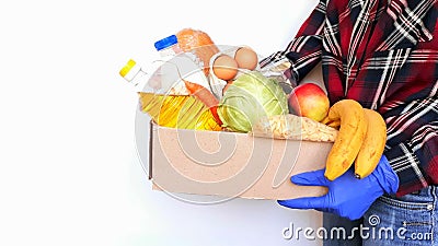 Fresh vegetables and fruits.Sharing food concept. Delivery of products. donation box. Volunteer collecting food. Coronavirus Stock Photo