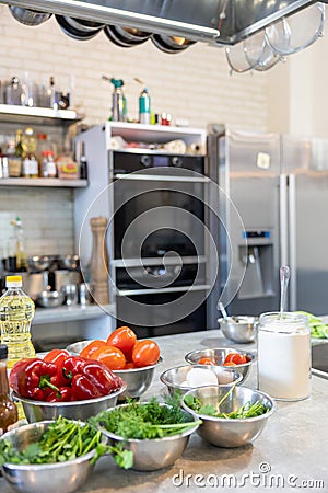 Fresh Vegetables lie in a metal bowls: tomatoes, asparagus, cucumbers, green. Fresh Vegetables lie in a metal bowls Stock Photo