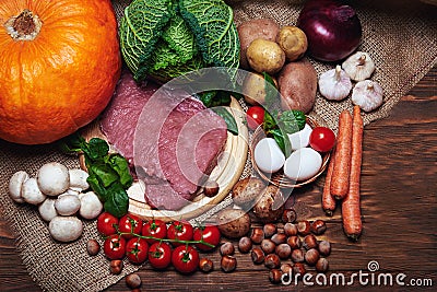 Fresh vegetables and raw meat on a sacking Stock Photo