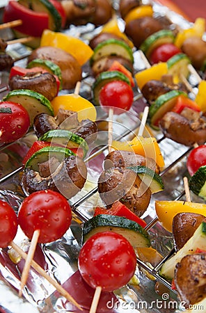 Fresh vegetables on spits ready for BBQ Stock Photo