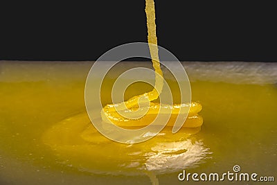 Fresh viscous floral honey flows onto the plate. vitamin organic food Stock Photo