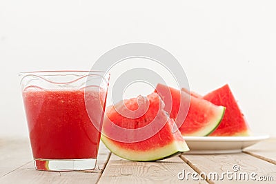 Fresh watermelon blending in glass on wood table Stock Photo