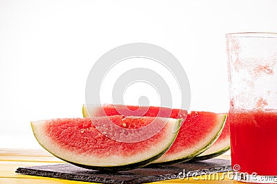 Fresh watermelon slices and juice drink. Thirst quenching refreshing summer smoothie. Stock Photo