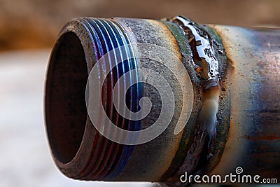 Fresh weld bead on a metal tube macro Stock Photo