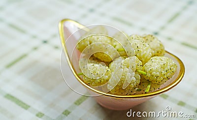 Fresh white mulberry bowl on tablecloth Stock Photo