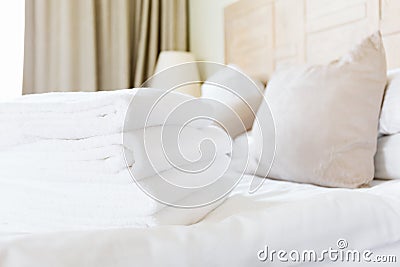 Fresh white towel pile in the upscale hotel room. Being alone, getaway, staycation, digital detox, trip, vacation Stock Photo