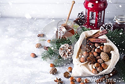 Fresh whole nuts and spices spilling Stock Photo