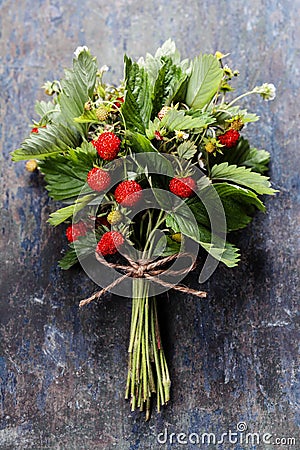 Fresh Wild strawberries on wooden background Stock Photo