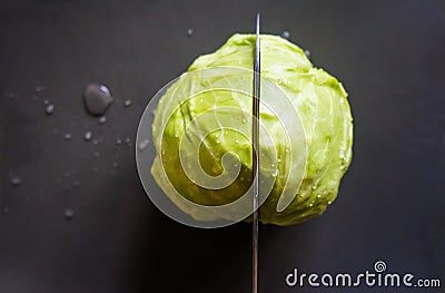 Fresh young head of cabbage on a cutting board Stock Photo