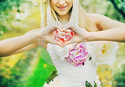 Fresh young lady making the heart sign Stock Photo