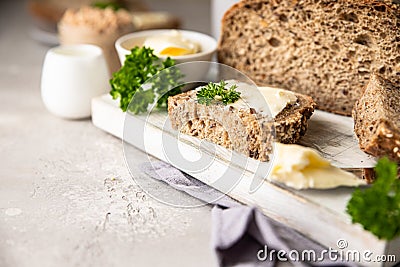 Freshly baked artisan multigrain bread with butter and pate. Breakfast with coffee, sliced bread, butter and liver pate Stock Photo