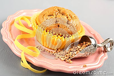Freshly baked buckwheat muffins on the rose plate Stock Photo