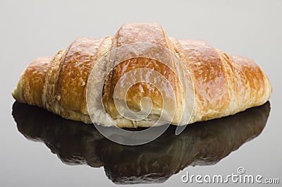 Freshly baked butter croissant on black background. Studio photo Stock Photo