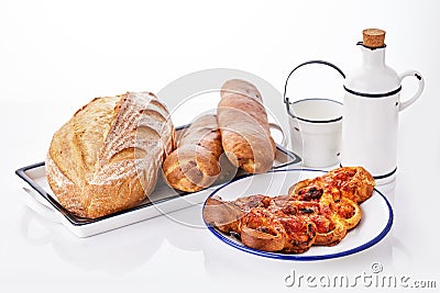 Freshly baked crusty homemade butter rolls and baked bread isolated on white background, traditional Bulgarian breakfast Stock Photo