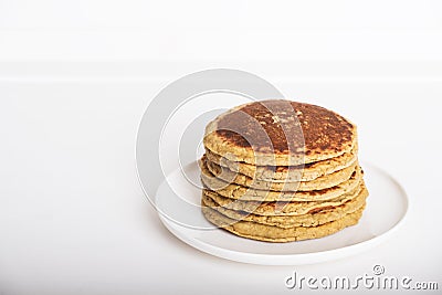 Freshly baked farinata pancakes on white background. Stock Photo