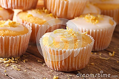 Freshly baked lemon muffins with frosting macro. horizontal Stock Photo