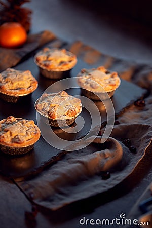 Freshly Baked Mince Pies On Table Set For Christmas With Cinnamon Sticks And Orange Stock Photo