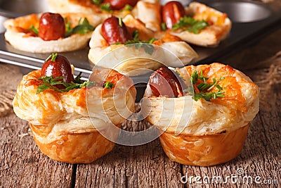 Freshly baked muffins with sausage, cheese and onion closeup. ho Stock Photo