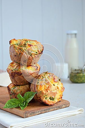 Freshly baked muffins with spinach, sweet potatoes and feta cheese on white background. Healthy food concept. Savory pastry Stock Photo