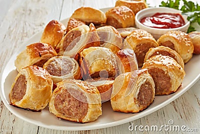 Freshly baked Puff pastry Sausage rolls, close-up Stock Photo