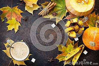 Freshly baked raisins and cinnamon biscotti and a cup of cappuccino coffee on a brown slate or slate background. Stock Photo