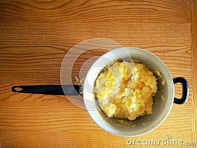 Freshly cooked polenta inside the pot waiting to be served. Polenta is an ancient dish of boiled cornmeal. Stock Photo