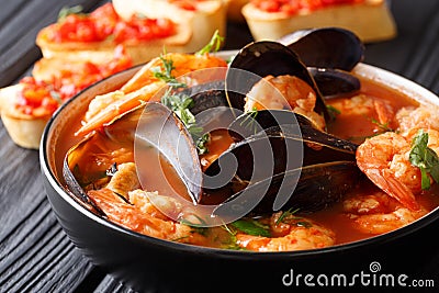 Freshly cooked seafood bouillabaisse soup with shrimps, fish fil Stock Photo