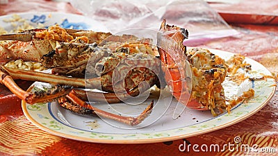 Freshly grilled Lobster on Union Island in the Tobago Cays of Saint Vincent and the Grenadines, Caribbean. Stock Photo