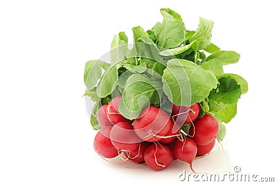 Freshly harvested red radish with green foliage Stock Photo