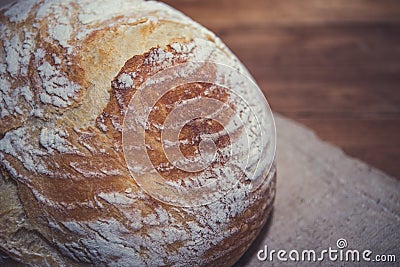 Freshly home baked bread on wooden background Stock Photo