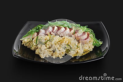 Freshly made Japanese rice served with pieces of fish and wakame Stock Photo