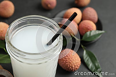 Freshly made lychee juice on grey table, closeup. Space for text Stock Photo
