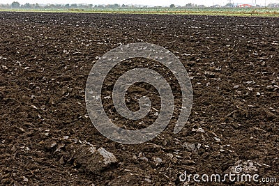 freshly plowed soil field in the foggy morning - close wide angle view with edge-to-edge sharpness Stock Photo