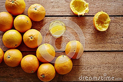 Freshly pressed orange juice and bunch of oranges Stock Photo