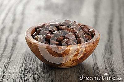 Freshly roasted arabica coffee beans in bowl Stock Photo