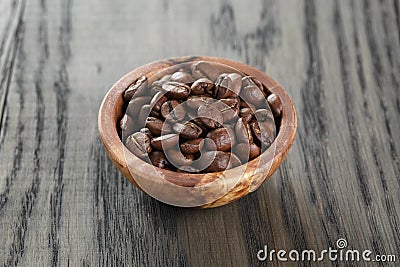 Freshly roasted arabica coffee beans in bowl Stock Photo