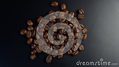 Freshly roasted coffee beans on dark background Stock Photo