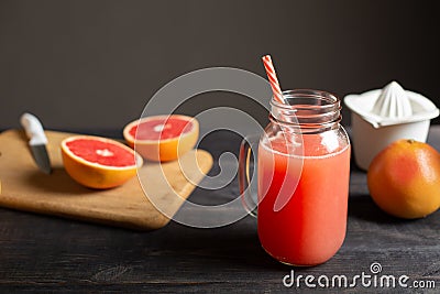 Freshly squeezed grapefruit juice in a jar with a handle. Stock Photo