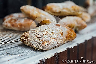 Freshly and warm baked bread rolls place on top marble counter for sell. Homemade by artisan Stock Photo