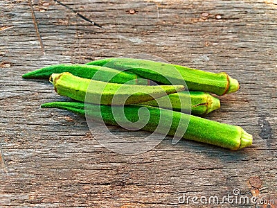 Freshness green okra on old wooden table and wood background Stock Photo