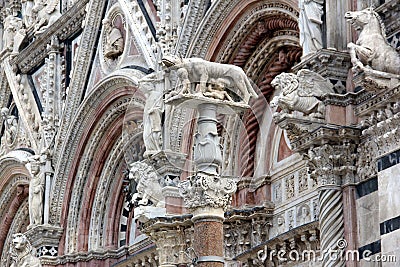 Fretwork and sculptures decorating Western facade of Siena Cathedral Editorial Stock Photo