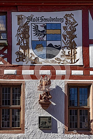 Coat of arms of Stadt Freudenberg - engl: town Freudenberg - with statue of angel as symbol of the town of Freudenberg, Germany Editorial Stock Photo